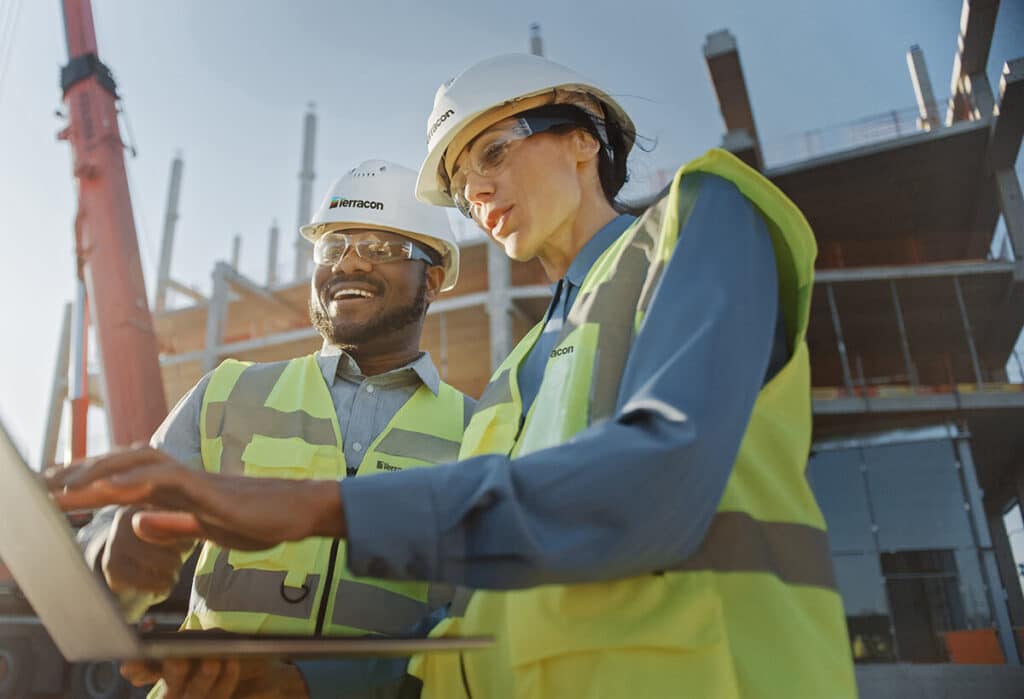 Terracon employees working on a laptop