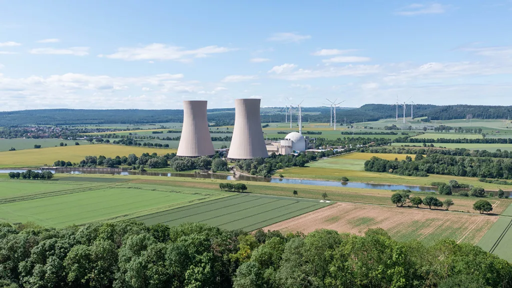 Photo of a nuclear facility on a calm day surrounded by open land.